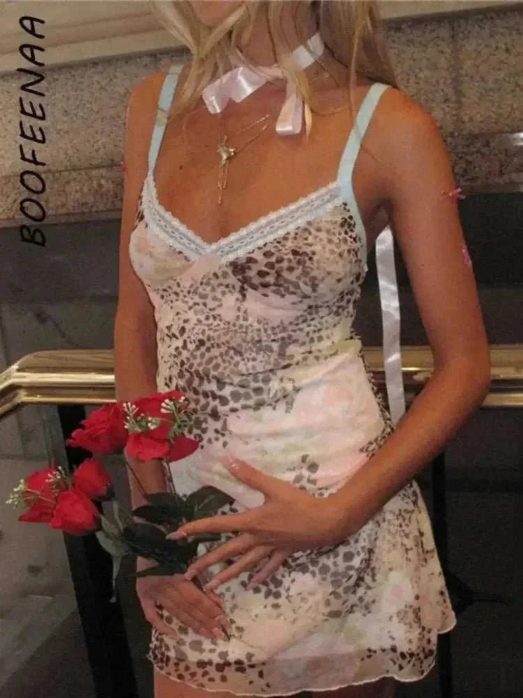 leopard print mesh fabric | v-neck mini dress | stretchy bodycon fit | ultrasonic cleaning