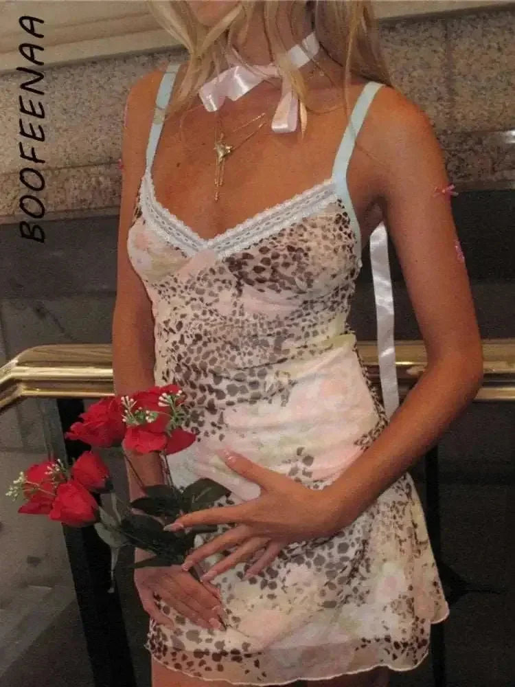 leopard print mesh fabric | v-neck mini dress | stretchy bodycon fit | ultrasonic cleaning